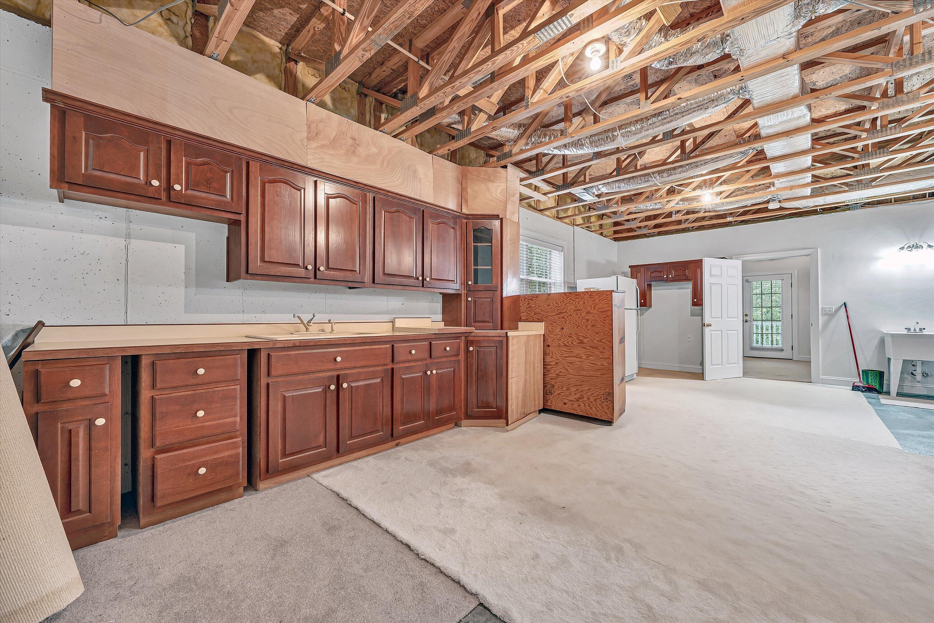 131 Stoney Mill Road Rocky Mount, VA 24151 - Photo 32 of 37 a kitchen with a sink and cabinets