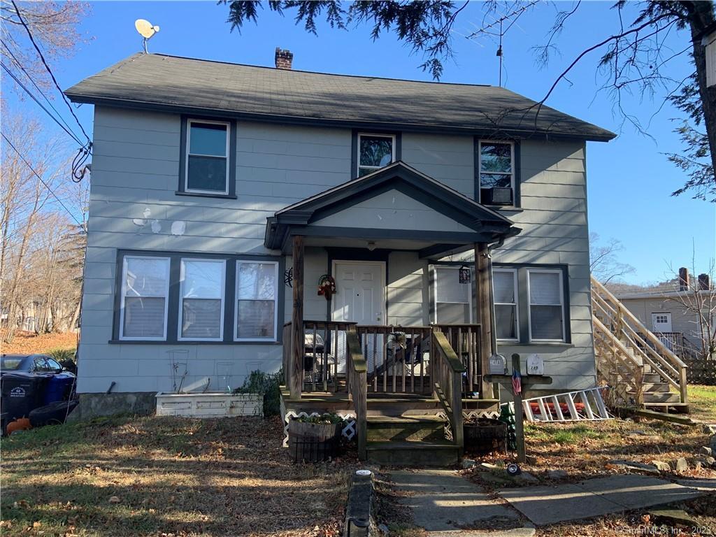 a front view of a house with street