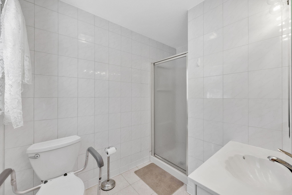 433 Ventura Street Ludlow, MA 01056 - Photo 19 of 39 a white toilet sitting next to a bath tub