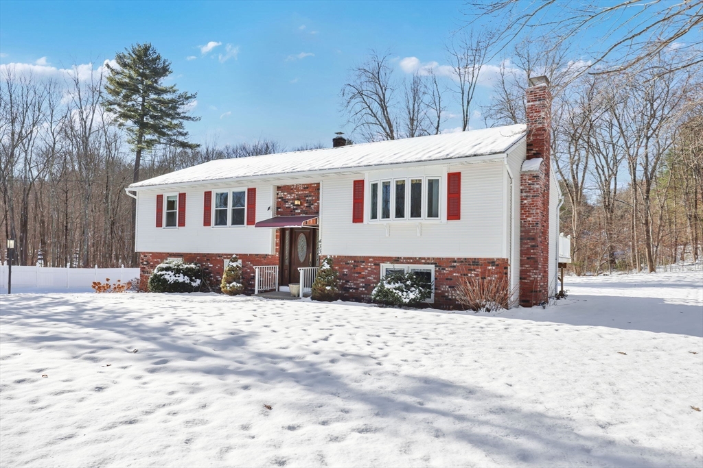433 Ventura Street Ludlow, MA 01056 - Photo 29 of 39 a front view of a house with a yard covered in snow