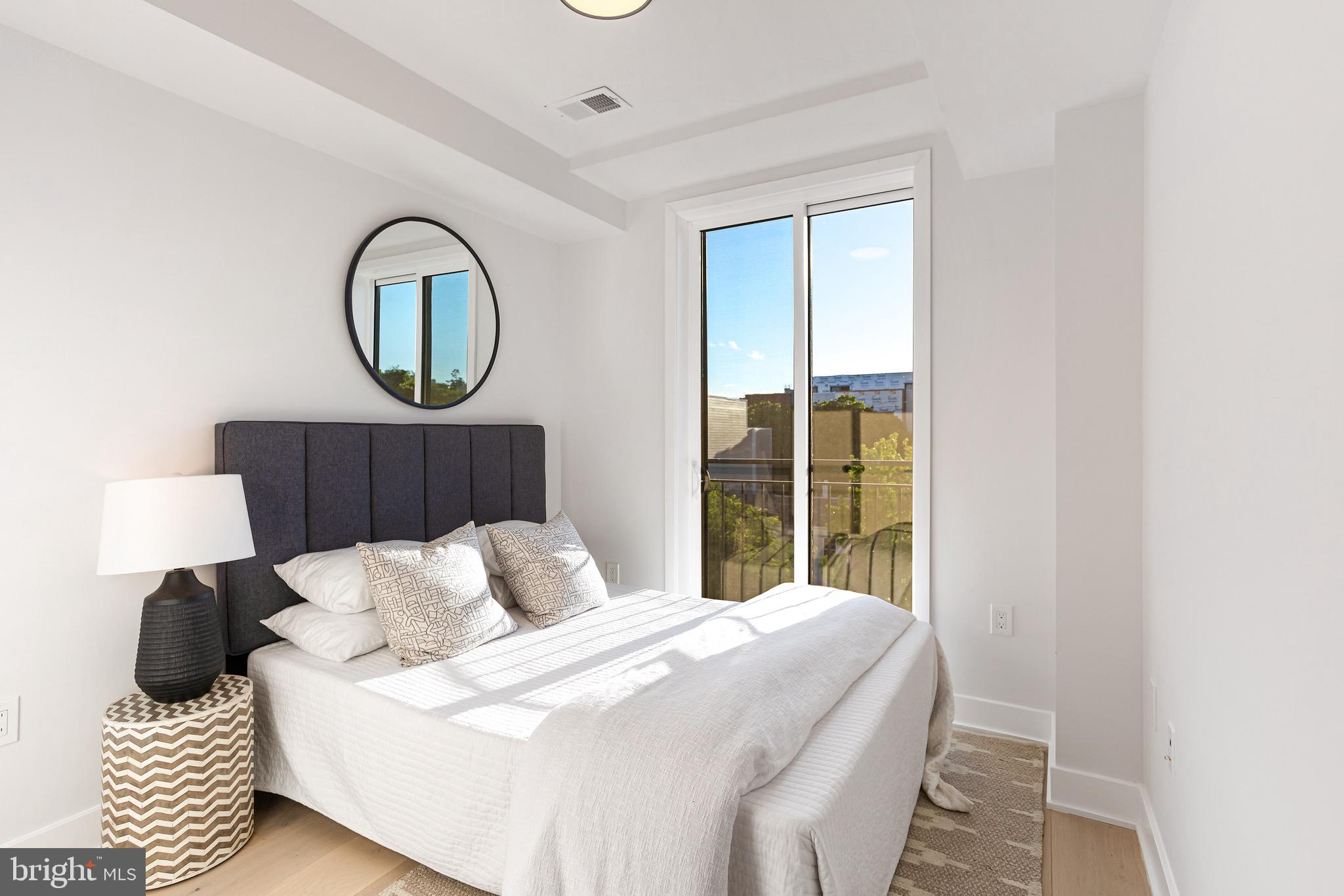845 19th Street Northeast, Unit 10 Washington, DC 20002 - Photo 16 of 22 a bedroom with a bed and a window