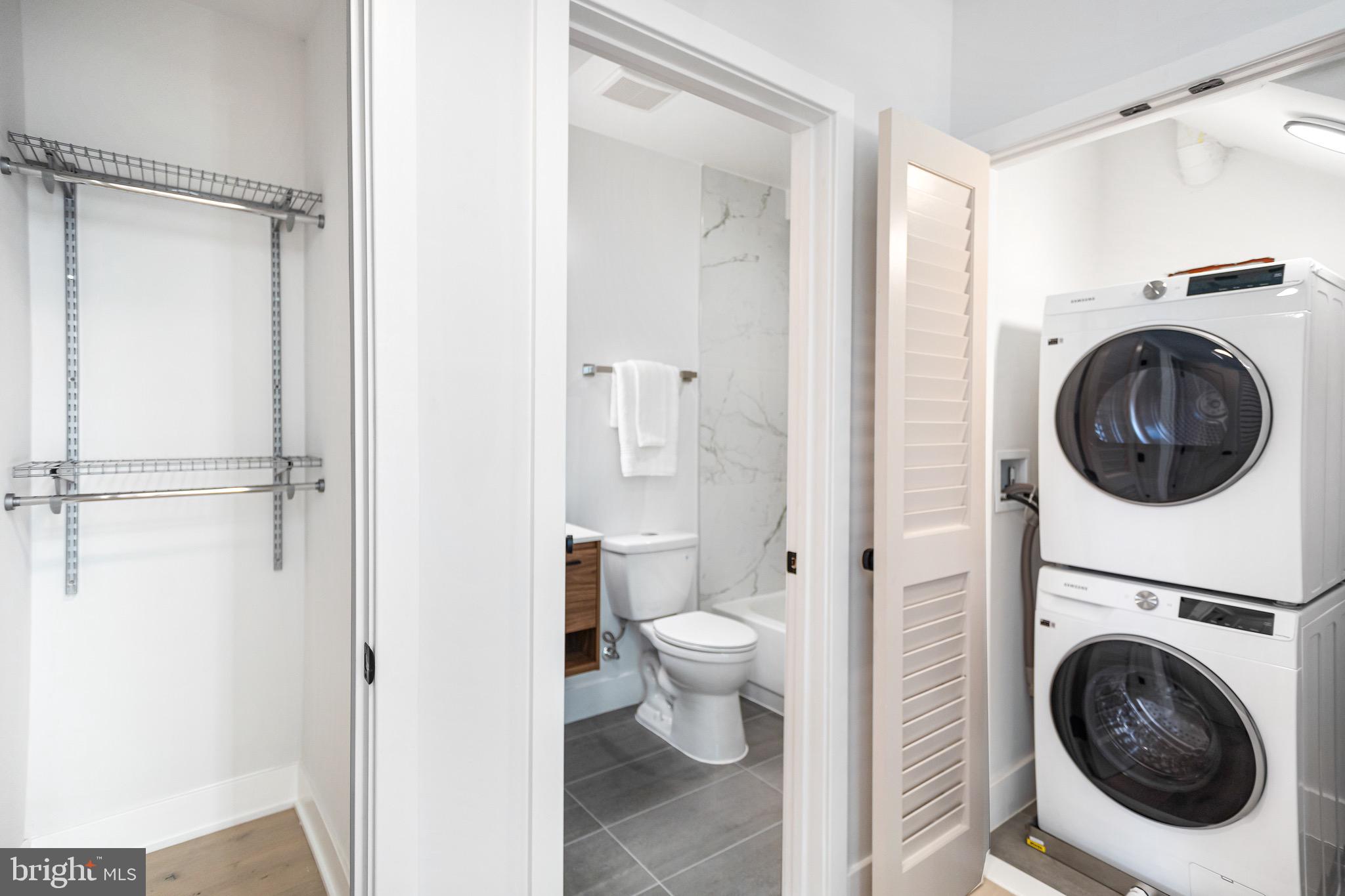 845 19th Street Northeast, Unit 10 Washington, DC 20002 - Photo 19 of 22 a view of a bathroom with a washer and dryer