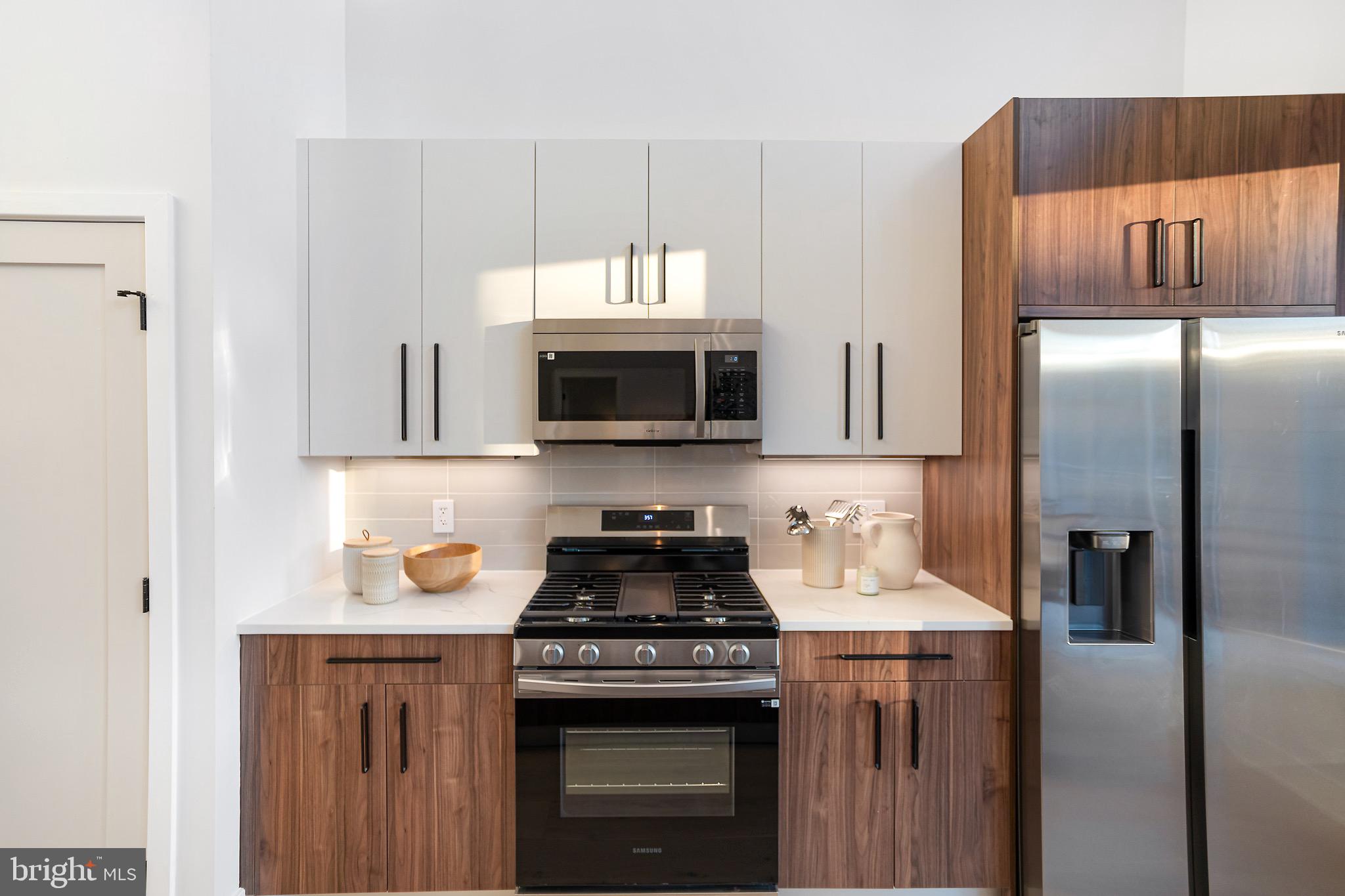 845 19th Street Northeast, Unit 10 Washington, DC 20002 - Photo 9 of 22 a kitchen with a stove and a microwave