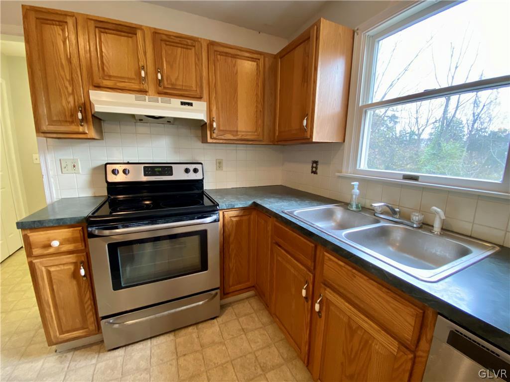 4755 McDermott Road Bangor, PA 18013 - Photo 11 of 37 a kitchen with a sink stove and microwave