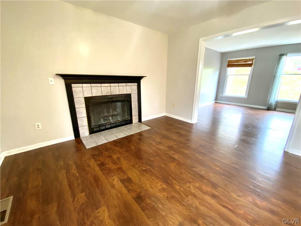 4755 McDermott Road Bangor, PA 18013 - Photo 13 of 37 a view of an empty room with wooden floor fireplace and a window