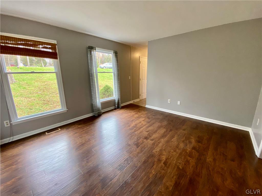 4755 McDermott Road Bangor, PA 18013 - Photo 3 of 37 a view of an empty room with wooden floor and a window