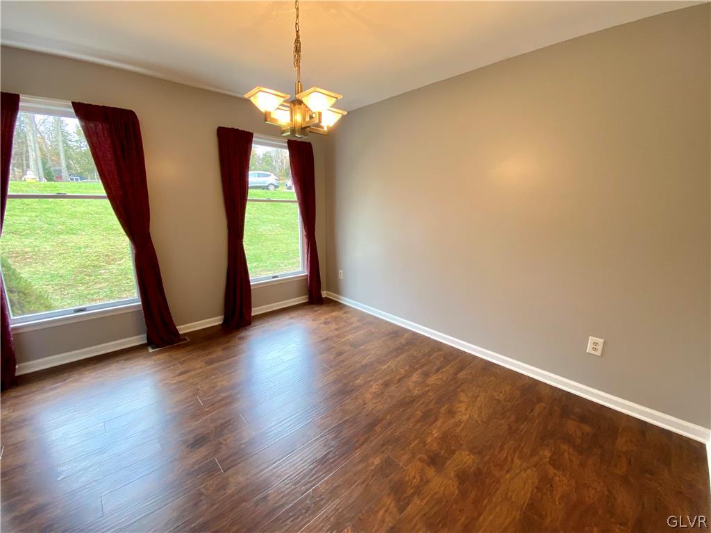 4755 McDermott Road Bangor, PA 18013 - Photo 7 of 37 an empty room with wooden floor and windows