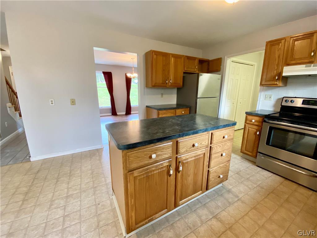 4755 McDermott Road Bangor, PA 18013 - Photo 8 of 37 a kitchen with stainless steel appliances granite countertop a sink and a stove