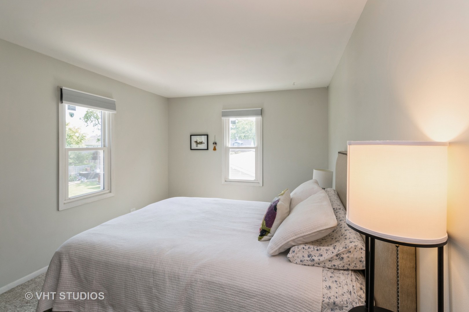 49 South Quentin Road Palatine, IL 60067 - Photo 16 of 25 a bedroom with a bed a dresser and windows