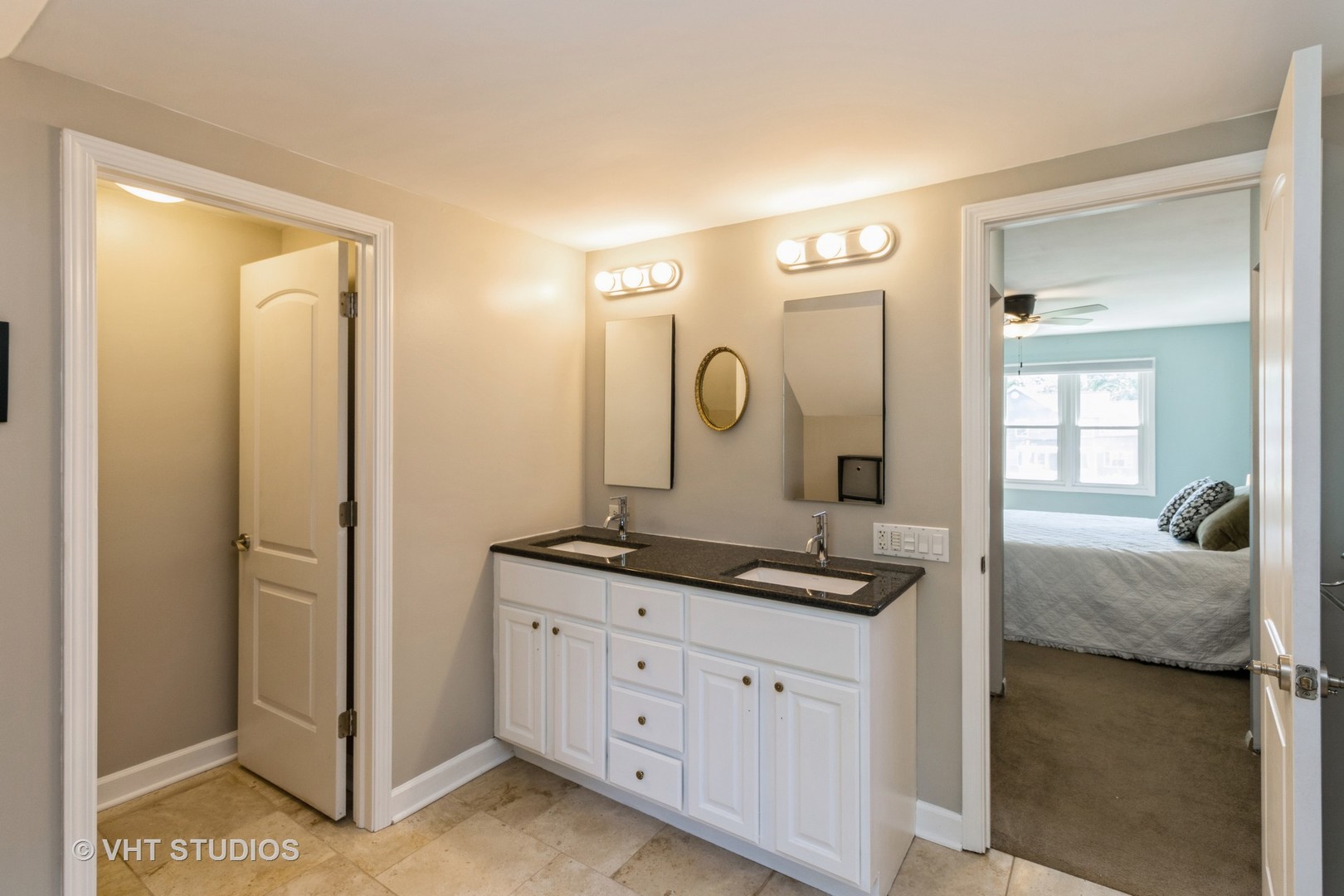 49 South Quentin Road Palatine, IL 60067 - Photo 22 of 25 a en suite bathroom with a granite countertop sink and a mirror