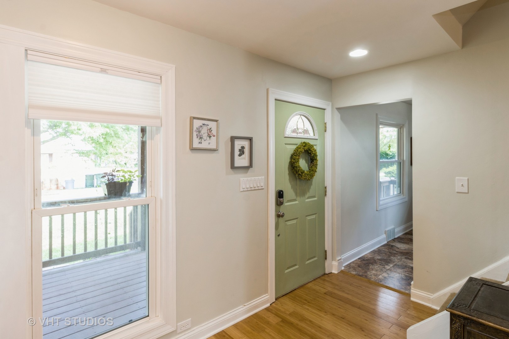 49 South Quentin Road Palatine, IL 60067 - Photo 3 of 25 a view of a hallway with bathroom and wooden floor