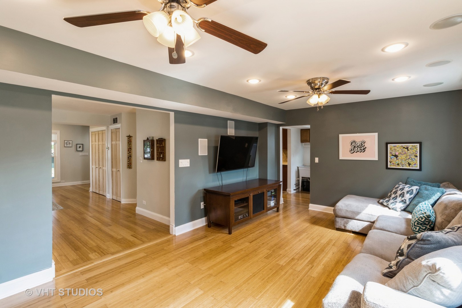 49 South Quentin Road Palatine, IL 60067 - Photo 7 of 25 a living room with furniture and a flat screen tv