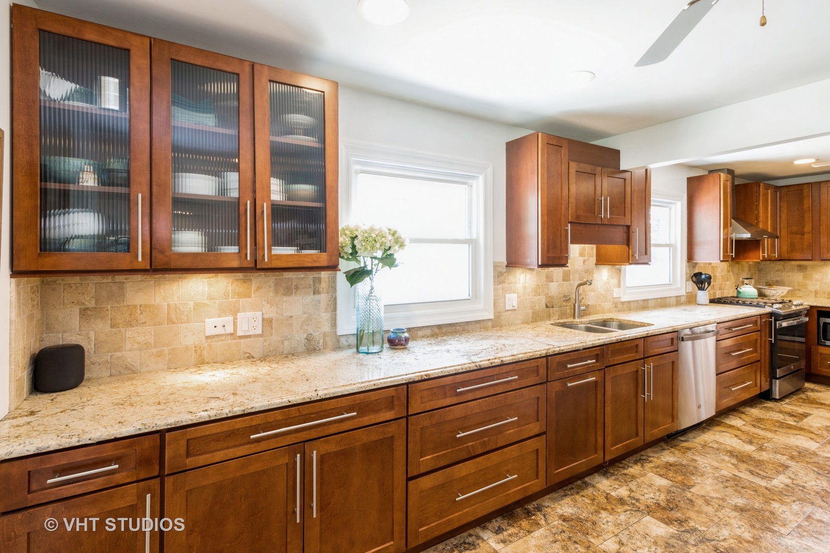 49 South Quentin Road Palatine, IL 60067 - Photo 8 of 25 a sink with granite countertop cabinets and view of living room