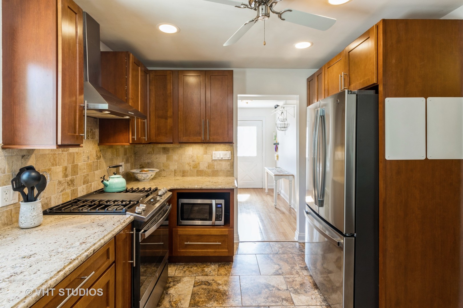 49 South Quentin Road Palatine, IL 60067 - Photo 10 of 25 a kitchen with stainless steel appliances granite countertop a refrigerator a sink and a stove