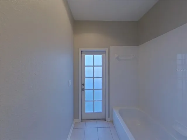 a view of bathroom with bathtub and shower