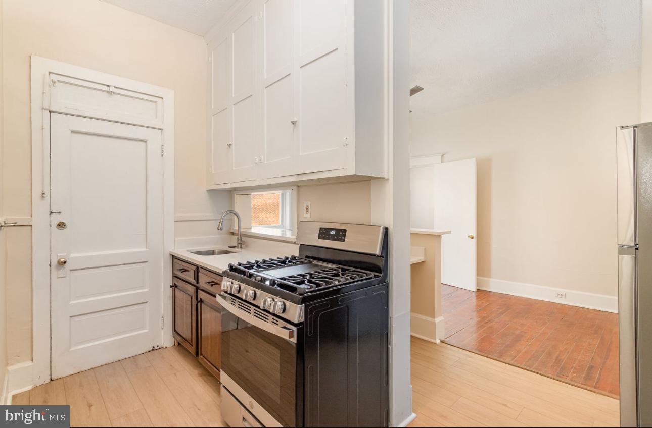 32 West High Street, Unit 301 Carlisle, PA 17013 - Photo 3 of 11 a kitchen with cabinets and appliances