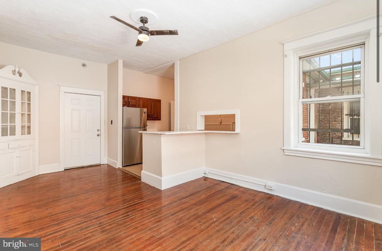32 West High Street, Unit 301 Carlisle, PA 17013 - Photo 6 of 11 a view of empty room with wooden floor and windows