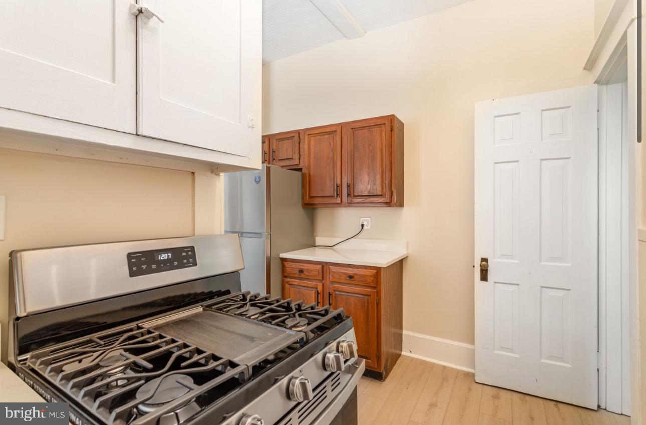 32 West High Street, Unit 301 Carlisle, PA 17013 - Photo 8 of 11 a kitchen with a stove and a microwave