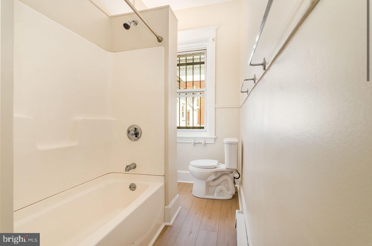 32 West High Street, Unit 301 Carlisle, PA 17013 - Photo 9 of 11 a bathroom with a bathtub and a toilet