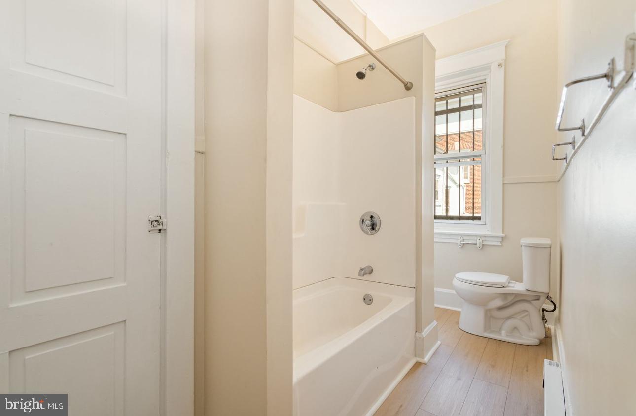 32 West High Street, Unit 301 Carlisle, PA 17013 - Photo 10 of 11 a bathroom with a sink a toilet and bathtub