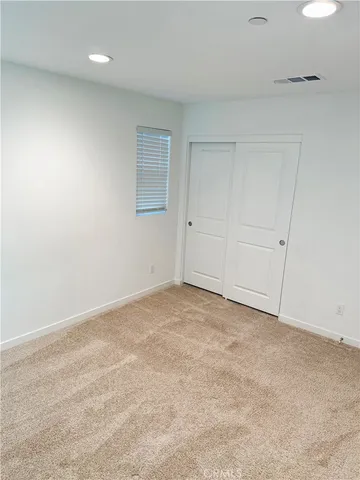 an empty room with sliding door
