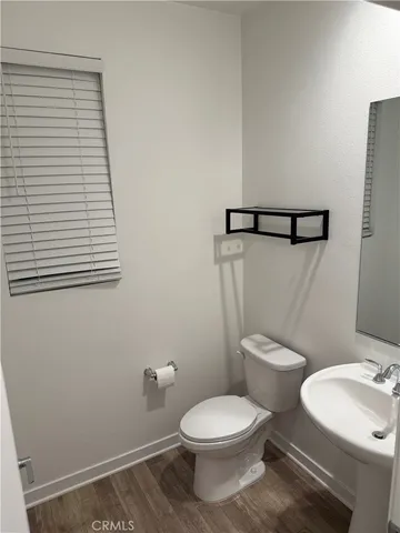 a bathroom with double sink and a mirror
