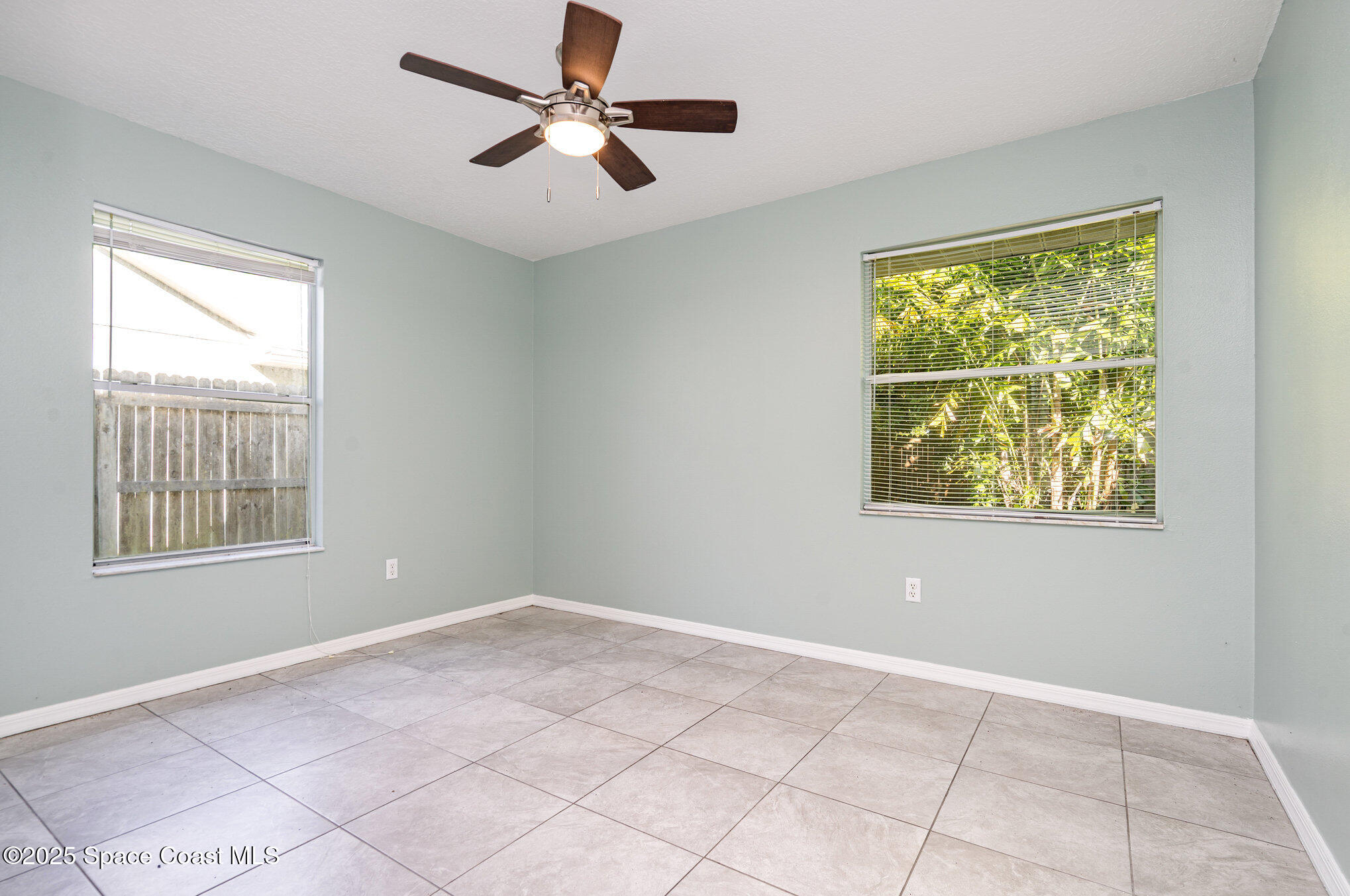 636 Fishtail Palm Boulevard Melbourne, FL 32901 - Photo 20 of 25 a view of an empty room with a window