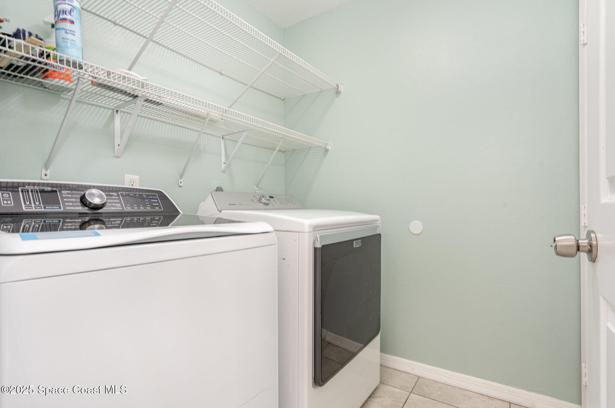 636 Fishtail Palm Boulevard Melbourne, FL 32901 - Photo 22 of 25 a utility room with dryer and washer