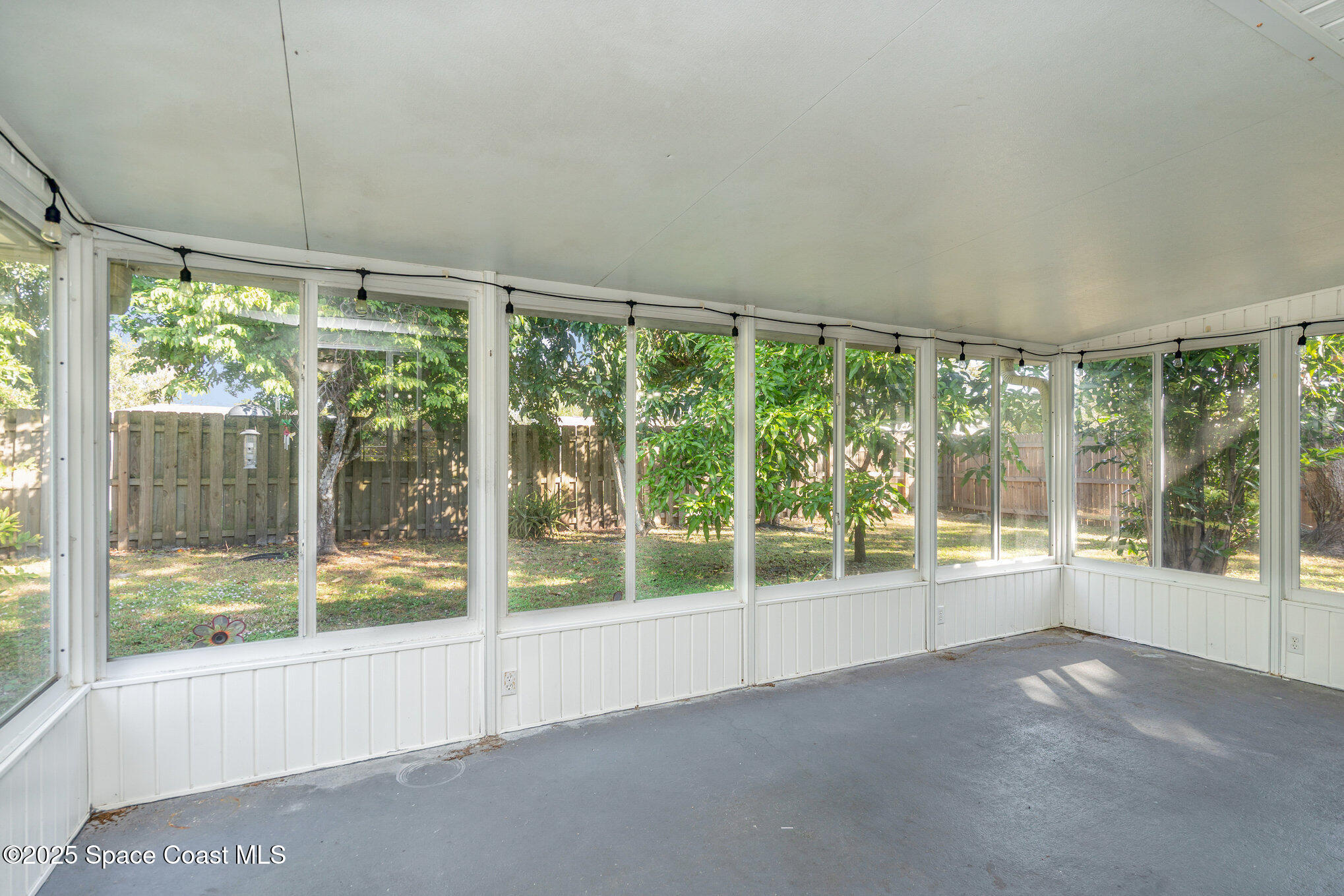 636 Fishtail Palm Boulevard Melbourne, FL 32901 - Photo 23 of 25 a view of empty room with wooden floor and fan