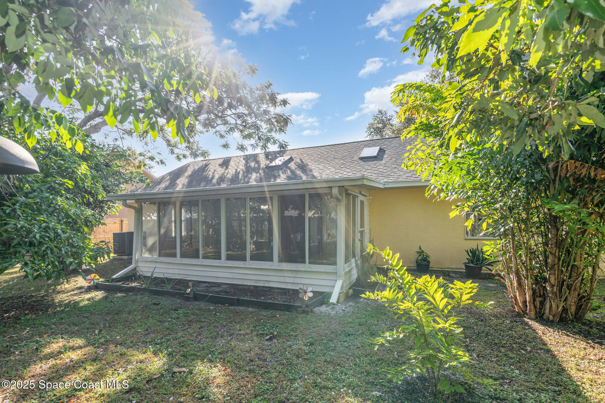 636 Fishtail Palm Boulevard Melbourne, FL 32901 - Photo 25 of 25 a view of a house with a garden