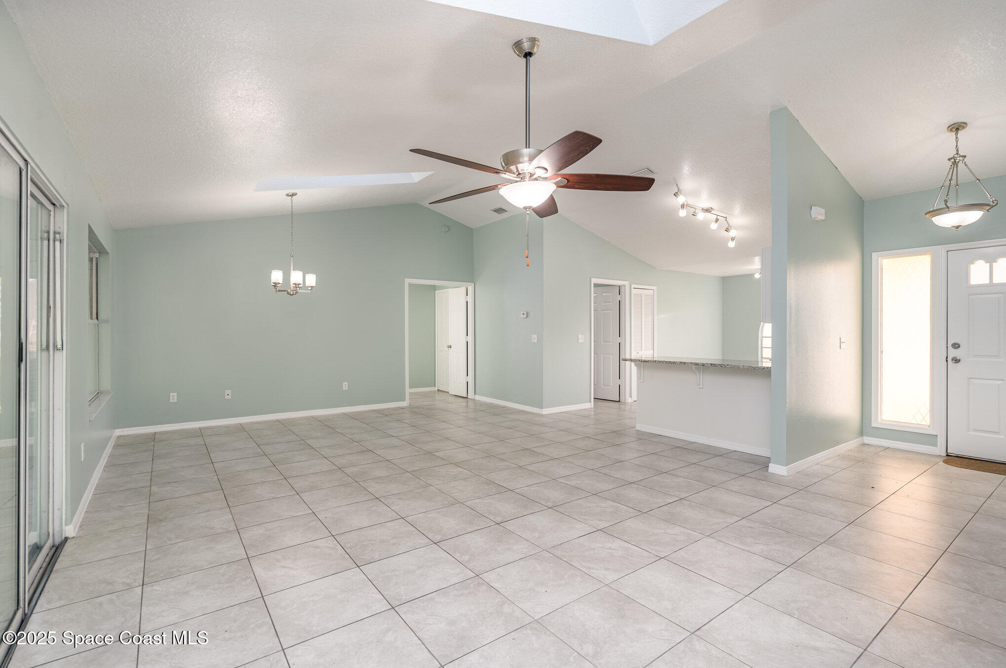 636 Fishtail Palm Boulevard Melbourne, FL 32901 - Photo 4 of 25 a view of an empty room and a chandelier fan
