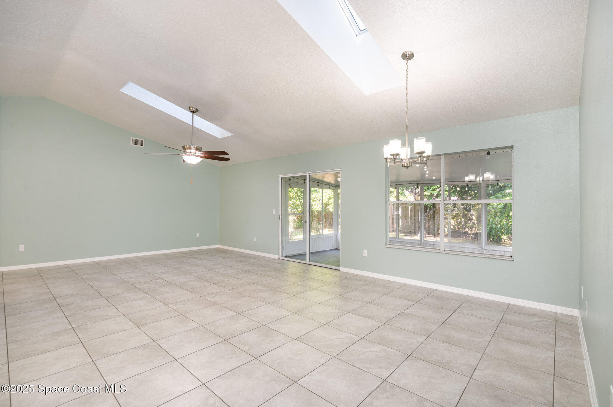 636 Fishtail Palm Boulevard Melbourne, FL 32901 - Photo 6 of 25 a view of an empty room with a window