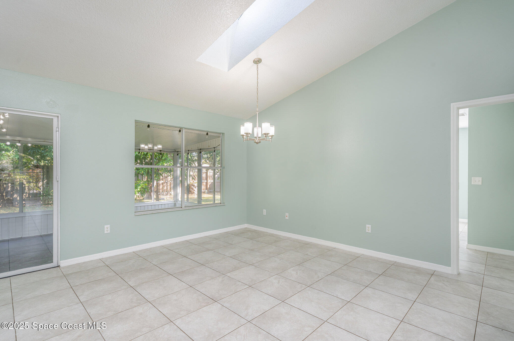 636 Fishtail Palm Boulevard Melbourne, FL 32901 - Photo 8 of 25 a view of an empty room with a window