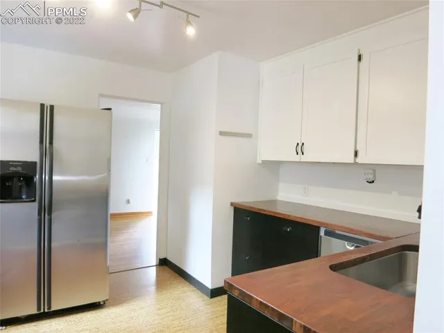 a kitchen with stainless steel appliances cabinets and a counter top