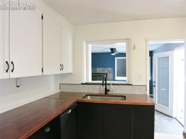 a kitchen with a sink and cabinets