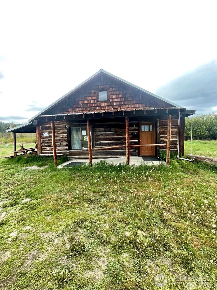 0 A Chopaka Way East Tonasket, WA 98855 - Photo 13 of 19 a front view of a house with a garden