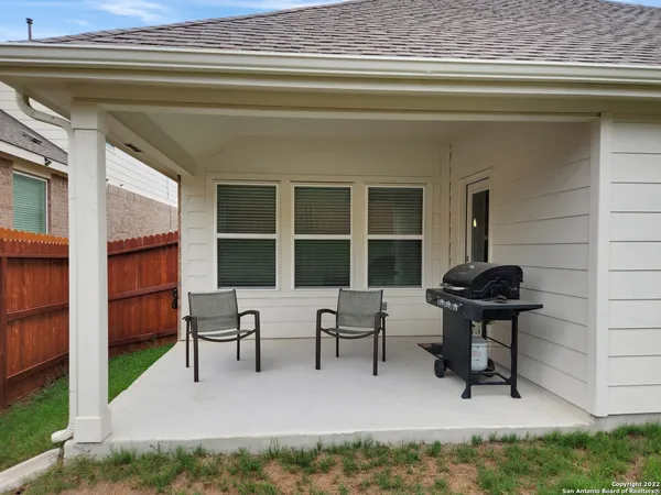 a view of a backyard with potted plants