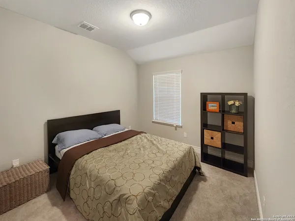 a living room with a couch and a window