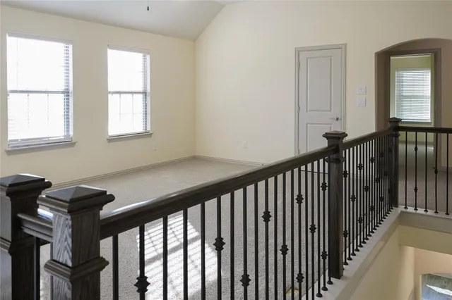 a view of a hallway with windows