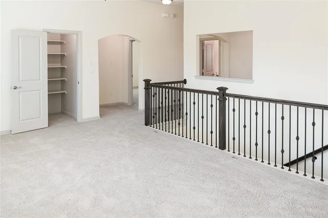 a view of a hallway with closet and entryway