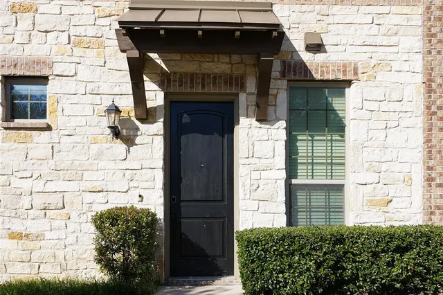 a front view of a house with a garage