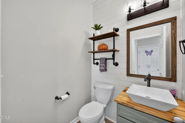 a view of a hallway view with wooden floor and furniture