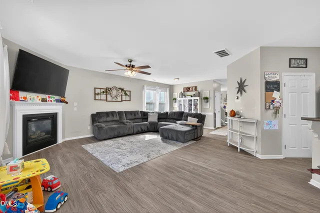 a room with furniture and a flat screen tv