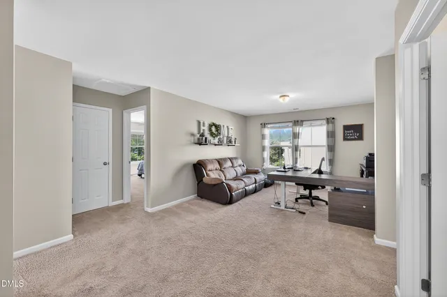 a kitchen with stainless steel appliances granite countertop a sink stove microwave and refrigerator