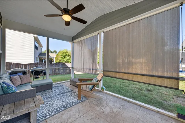 a bathroom with a sink a toilet and shower curtain
