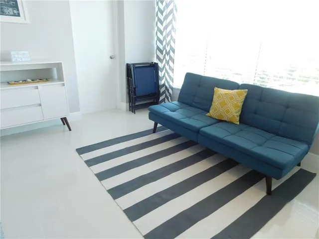 a kitchen with stainless steel appliances granite countertop a stove a microwave and a refrigerator