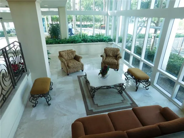 a living room with furniture pool table and table
