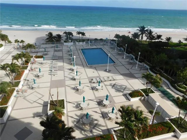 a view of a hallway with large mirror
