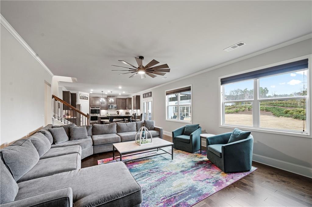 6780 Rambling Vale Dawsonville, GA 30534 - Photo 18 of 53 a living room with furniture and a large window