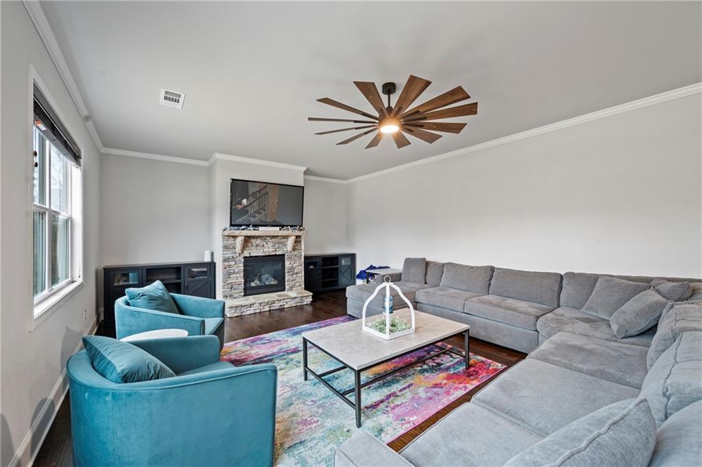 6780 Rambling Vale Dawsonville, GA 30534 - Photo 19 of 53 a living room with furniture and a fireplace